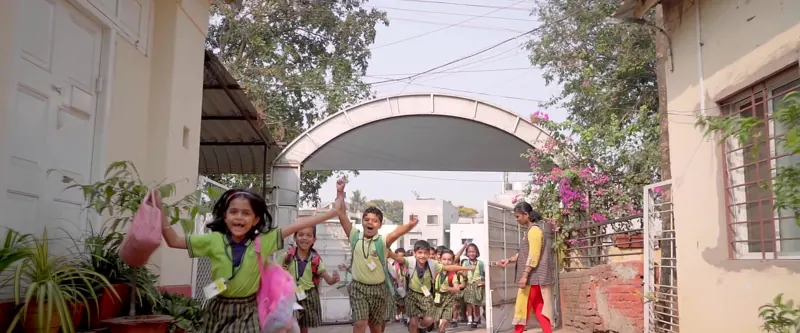 Children running in through the Gaonbhag gate