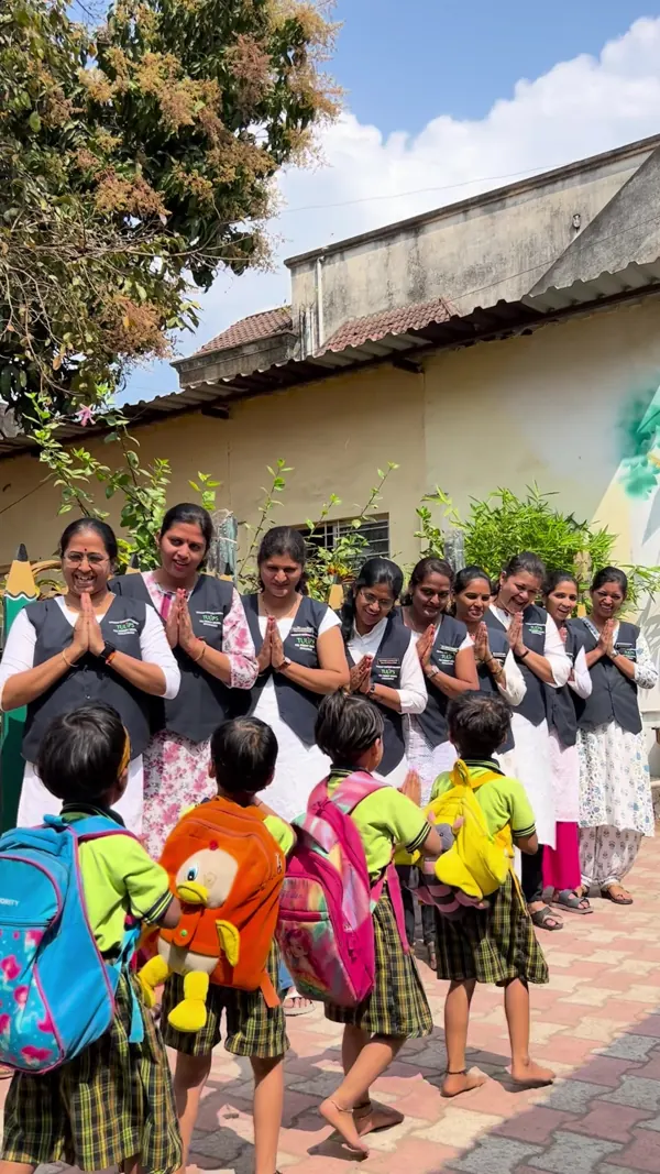 Teachers welcome the children